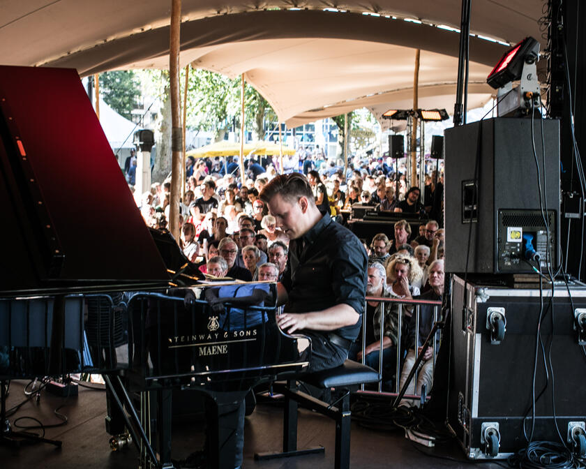 Piano player on the stage of the Jazz in the Park festival in Ghent. 