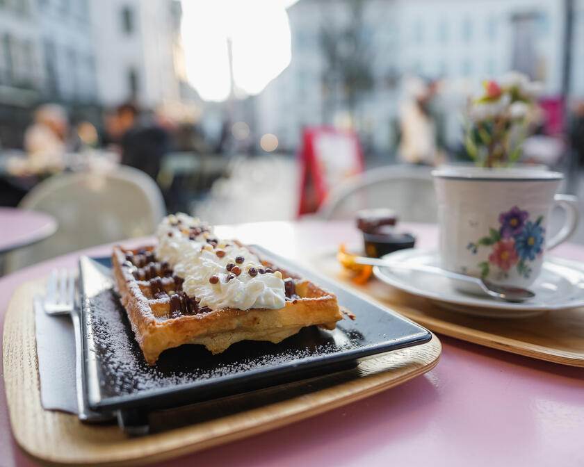 Waffle and coffee on a terrace