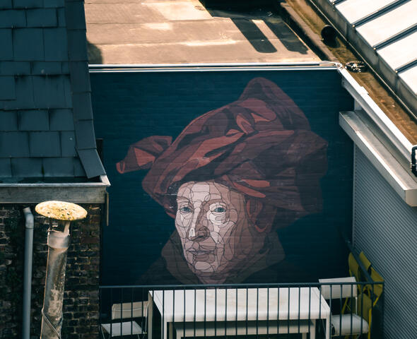 Street Art werk gebaseerd op "Man met de rode tulband" van Jan Van Eyck. 