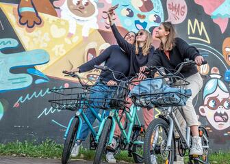 Friends on bikes taking a selfie
