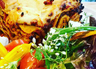 Homemade lasagne with salad
