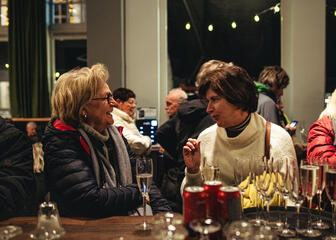 2 women having a chat and a drink in the shop
