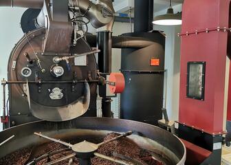 large coffee roaster in red and black