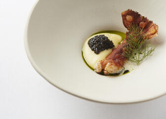 white plate with langoustine, mousseline and caviar