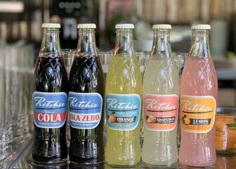 bar with bottles of Ritchie soft drinks
