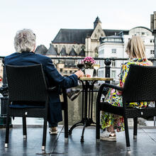 Couple on a terrace at the Graslei and Korenlei in Ghent