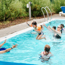 Families in the outdoor pool