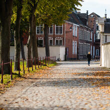 Woman walking in the Beguinage