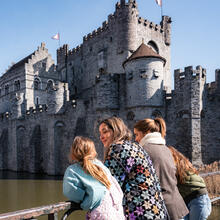 Tiany Kiriloff and her daughters look at the Castle of the Counts from a bridge in Ghent